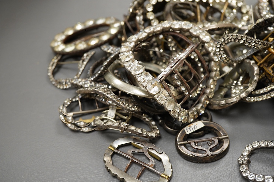 A large collection of buckles, 18th-19th century, of oval and rectangular outline, set with pastes mostly mounted in steel, a minority in silver, some with later brooch fittings